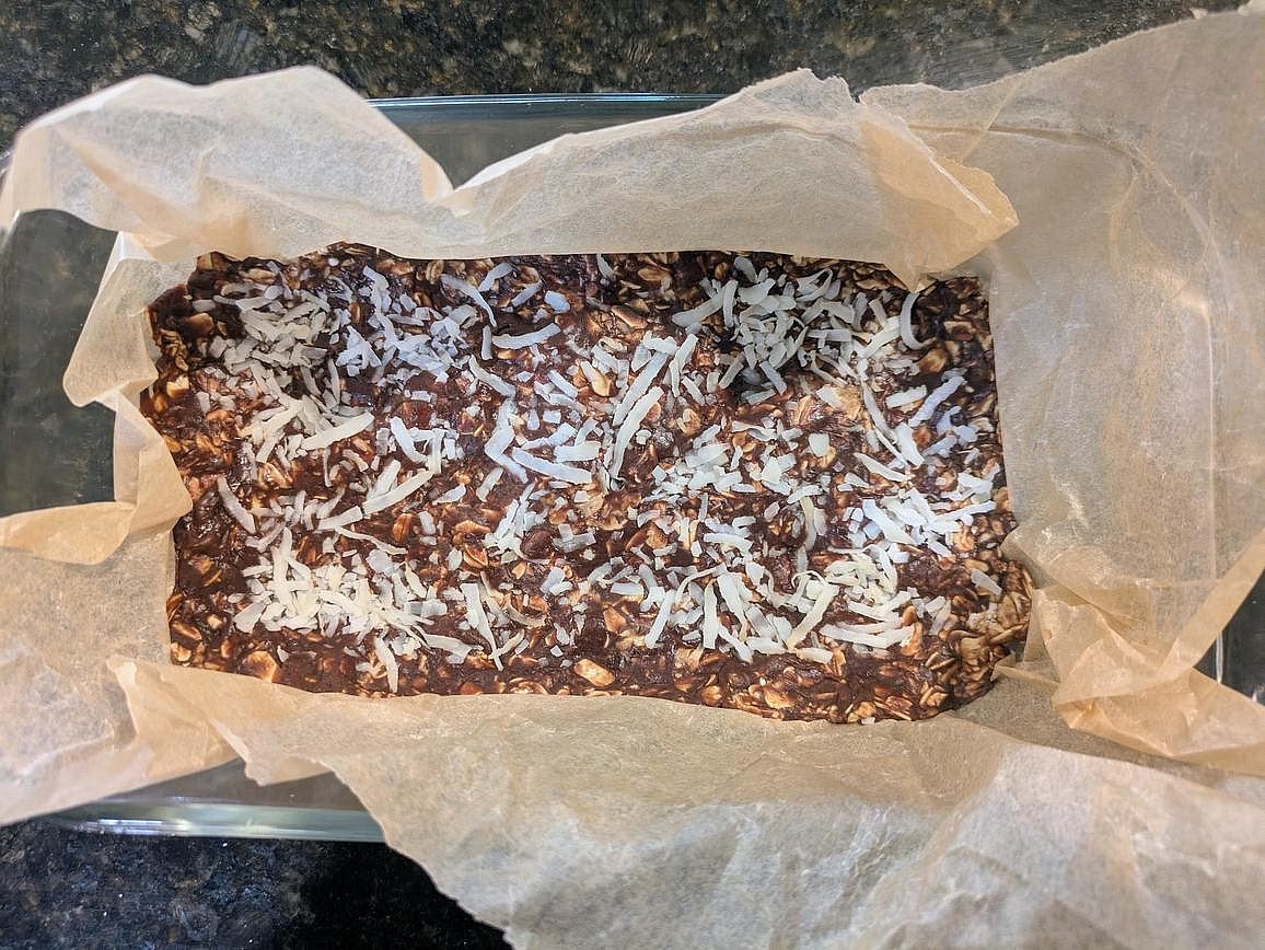 Optionally top with about 2 tsp (10 g) of mini chocolate chips, raisins, chopped nuts, or flaky salt. Here, I'm going with unsweetened coconut flakes