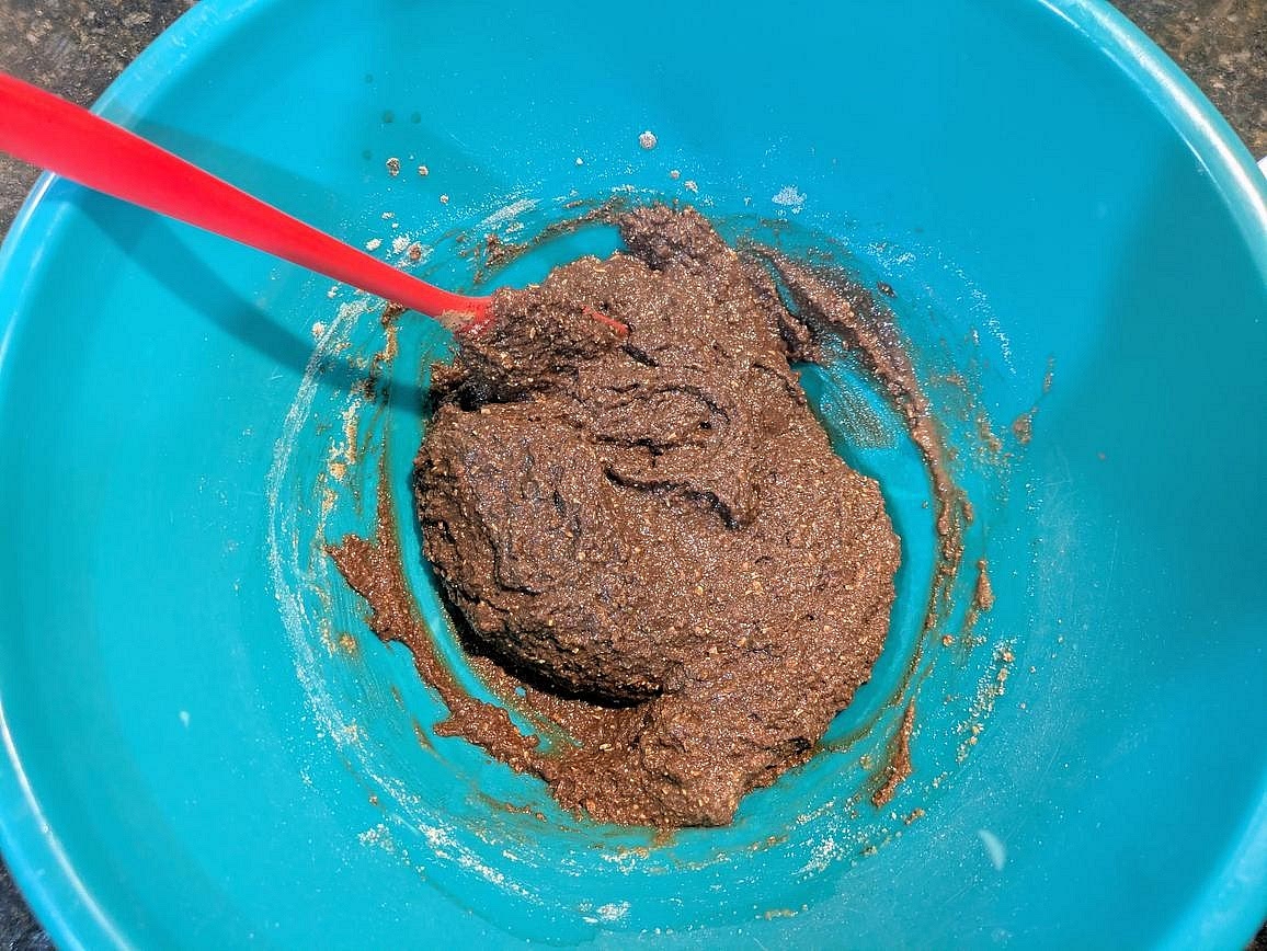 Add in the wet ingredients, and combine with a silicone spatula until you have a fully combined and sticky dough