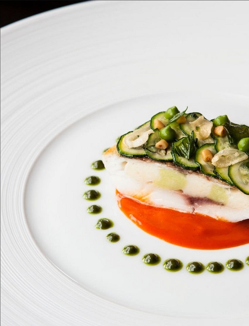 The Pour: Carefully pour the hot, golden saffron consommé around the base. Garnish with a single chervil leaf or a saffron thread