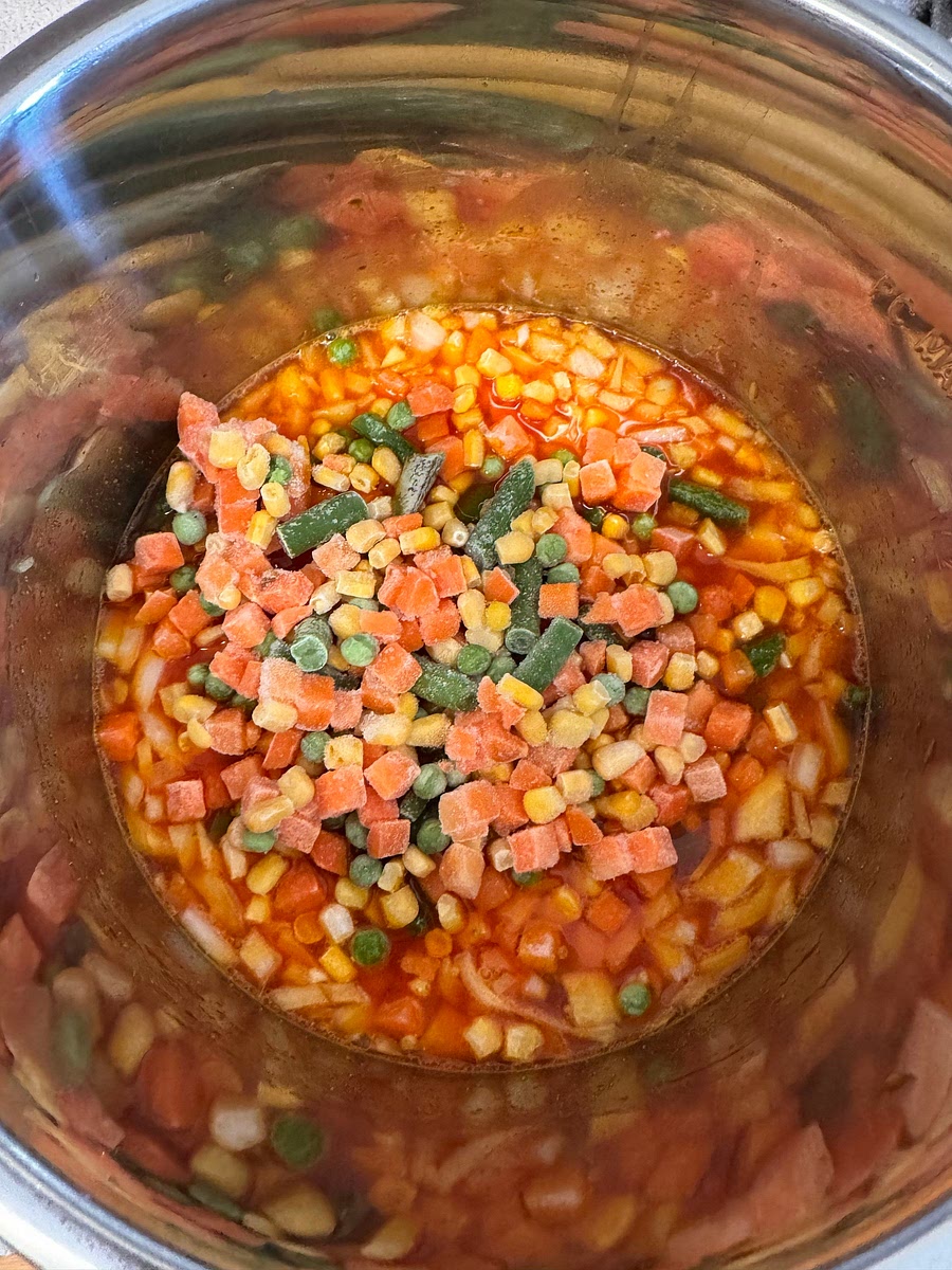 Add everything but the cilantro to the instant pot and stir. Pressure cook on high for 4 min, natural release for 10 min.