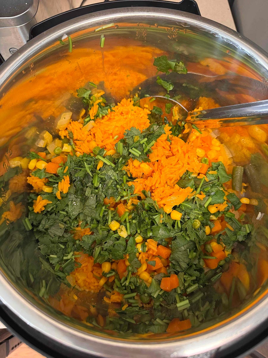 Add cilantro, stir, close back up for 5 min then ready to serve!