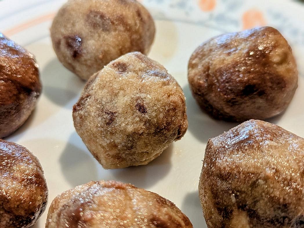 Line a large cookie sheet with parchment paper. Roll the dough into 32 balls, about 22 g each (1.5 tbsp). Store cookie dough bites in the fridge
