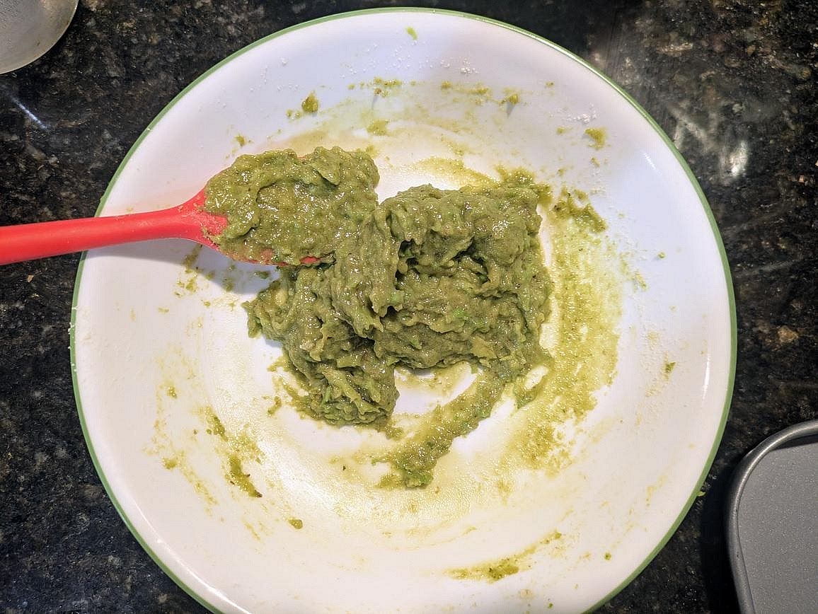 In a medium bowl, mash an avocado with the back of a fork. Mix in protein powder, mint extract, and salt with a silicone spatula to form a sticky dough