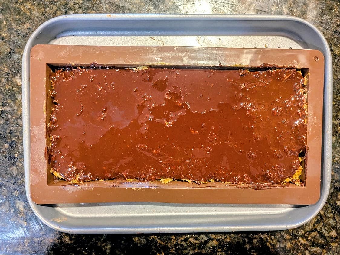 Pour your remaining melted chocolate over the filling