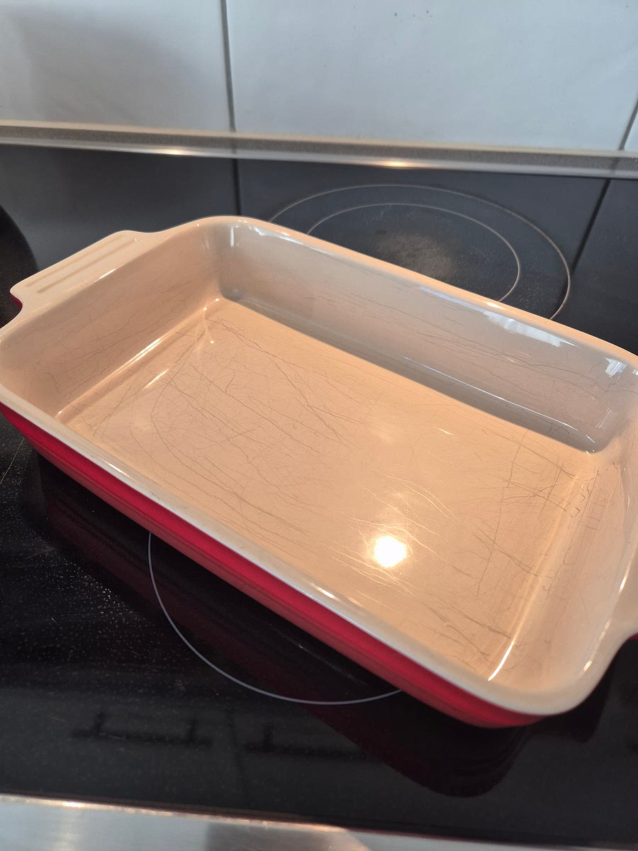 Heat the oven to 180°C / 160°C fan. Line a 20 cm square tin or ceramic dish with baking parchment.