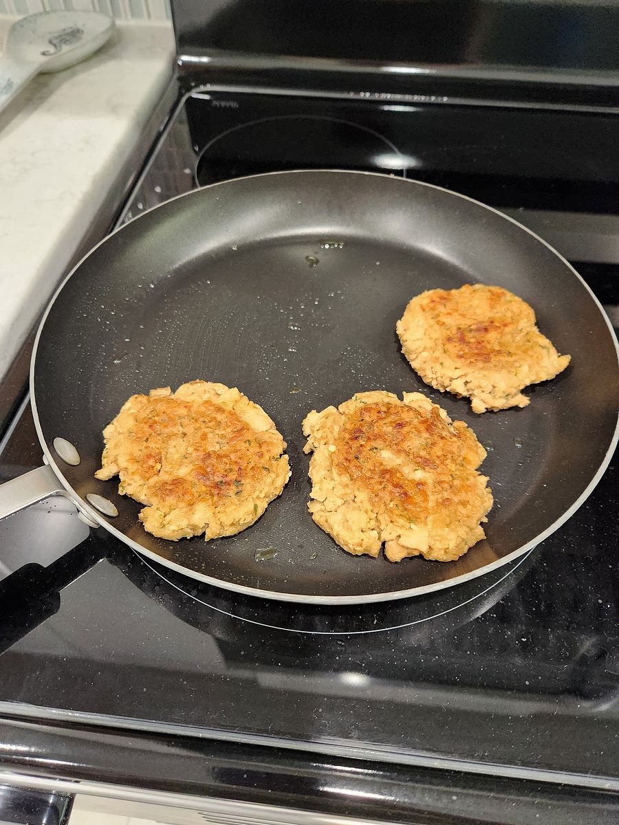 Form patties with hands and pan fry in some olive oil under golden brown on both sides.