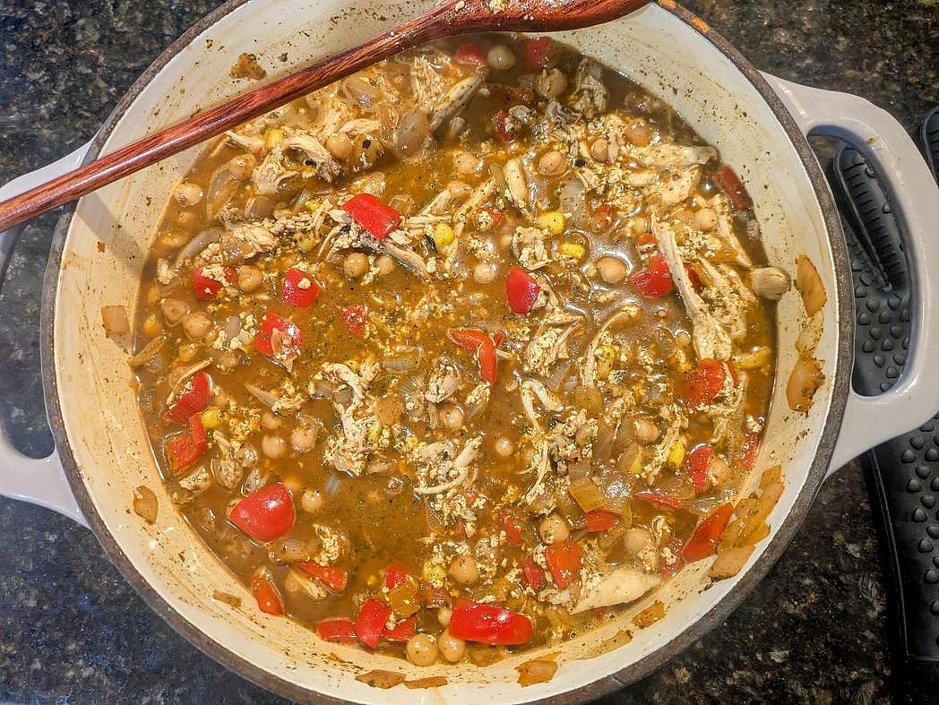 Remove from the heat, and optionally lightly blend with an immersion blender to make it creamier and thicker. Stir in your shredded cooked chicken, Greek yogurt, and lime juice. Serve