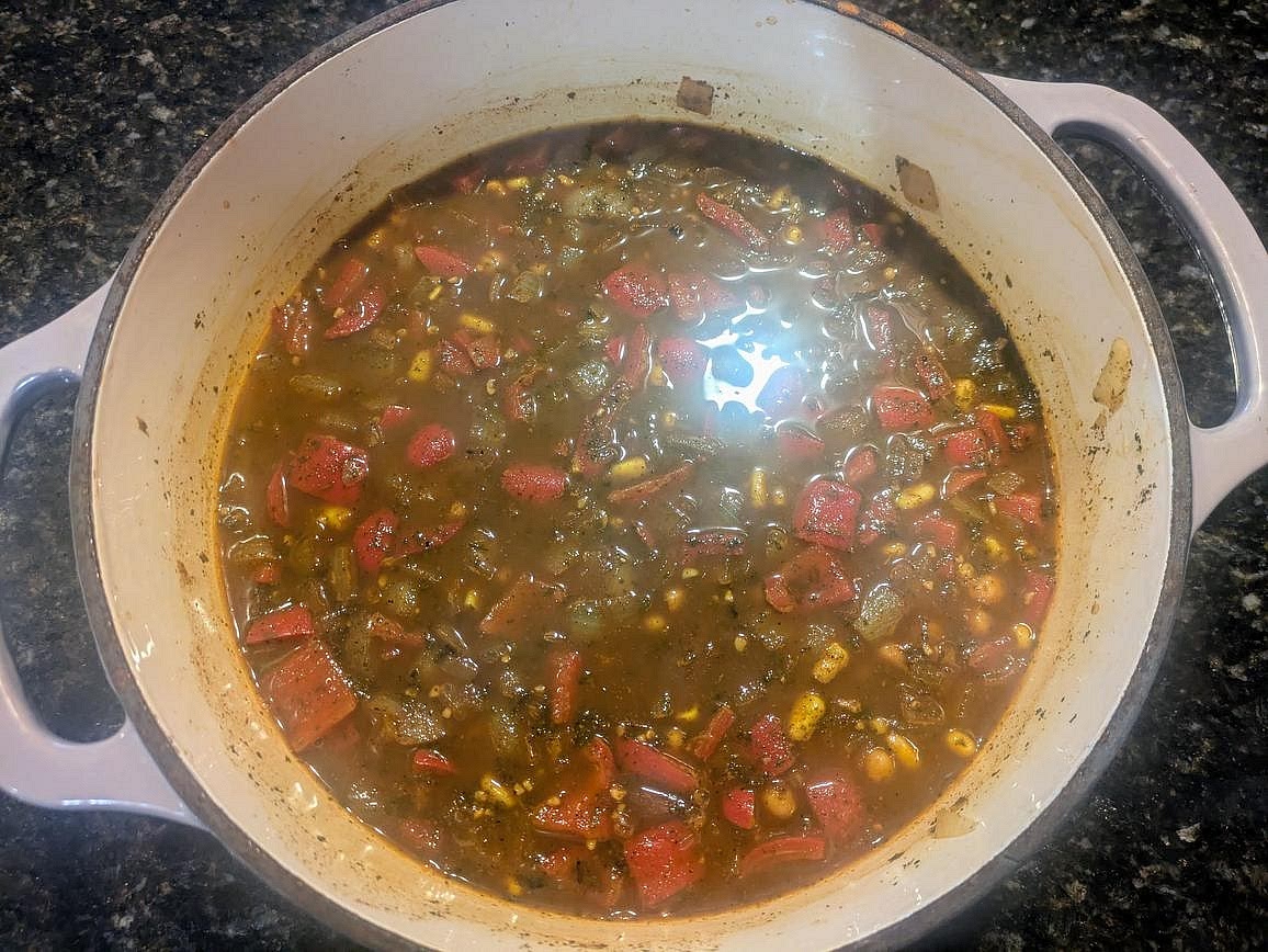 Pour in your broth. Cover and bring to a boil over high heat. Reduce heat to medium low, and let simmer for 20 minutes