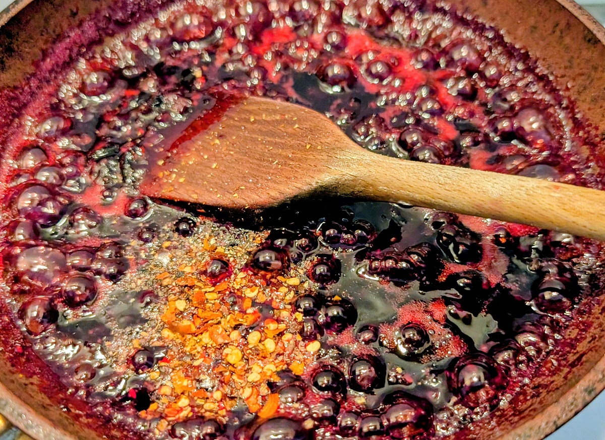 Stir in black pepper and red pepper flakes.