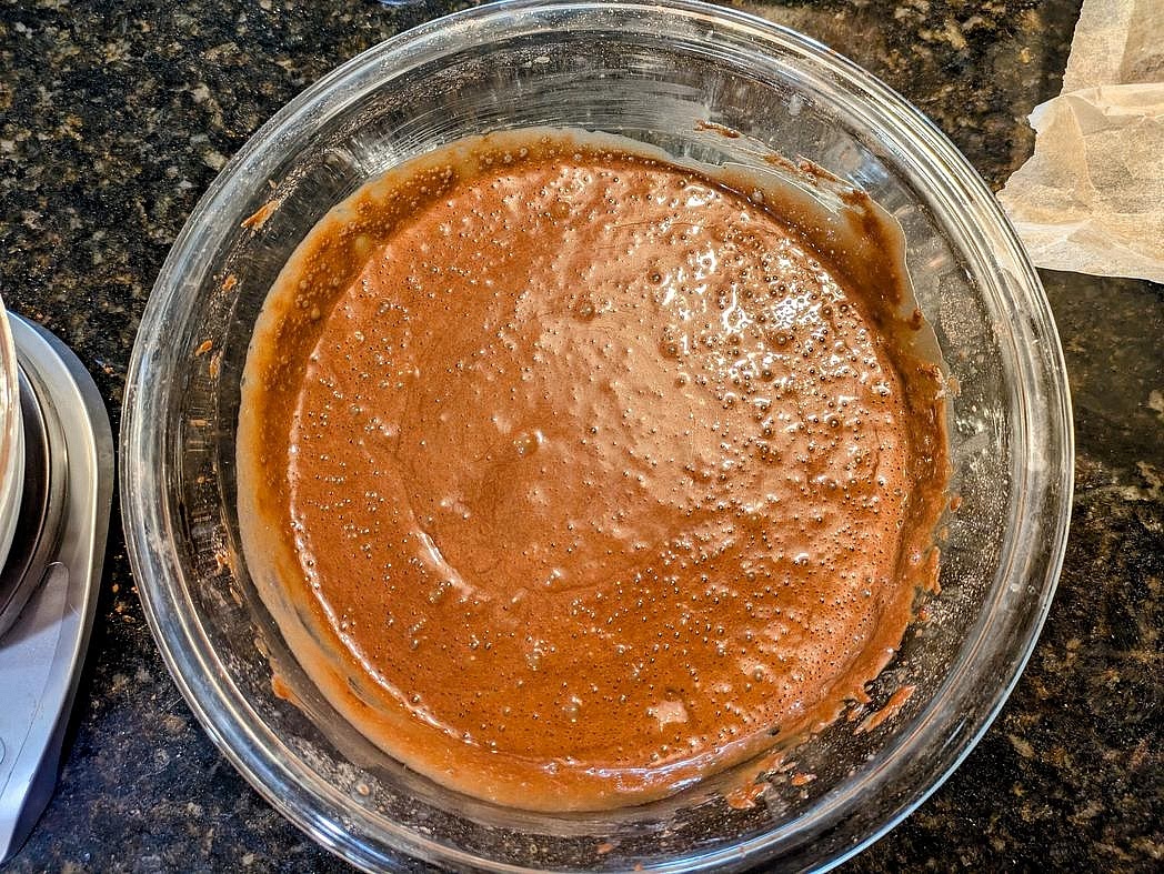 Add water to a medium glass, and microwave for 2 minutes. Pour in the boiling water, and beat together for about 30 seconds, until fully combined. The batter will be very thin