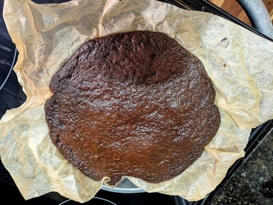 Bake for about 30 minutes, or until a toothpick to the center comes out clean, and the internal temperature is about 205F. Transfer the cakes to a wire rack. Take your block of cream cheese out of the fridge. Let both the cakes and the cream cheese sit on the counter for an hour