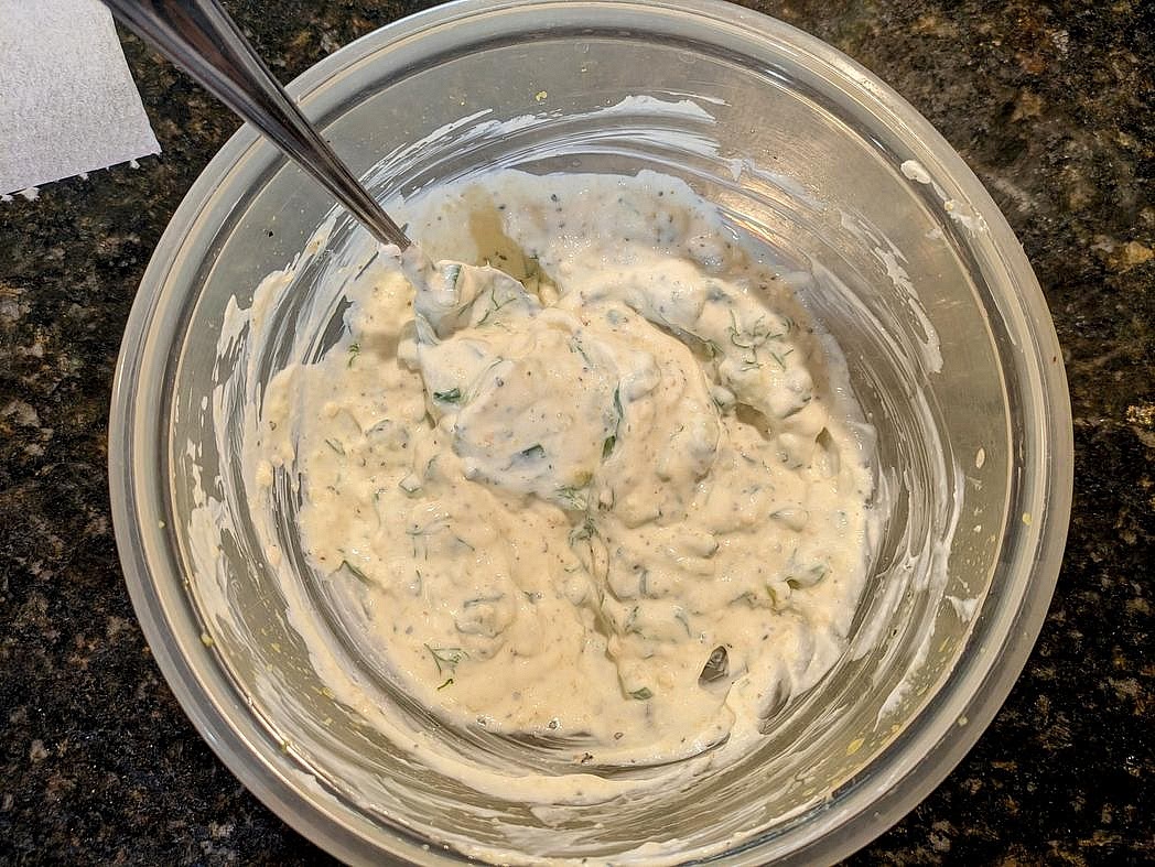Drain out the excess water. Add in the yogurt, lemon juice, minced garlic, garlic powder, onion powder, and fresh dill. Cover and refrigerate until ready to use