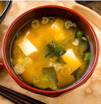 Dashi is good for only about 3-4 days in the fridge. Freeze in cubes for longer storage of about 3 months. Katsuobushi (flakes), must be used within 2 weeks of opening package as flavor oxidizes rapidly. Karebushi (block), is better to begin with, and can be shaved at home. Store plastic wrap + ziplock bag in fridge away from humidity and light. When purchasing Karebushi, look for 6+ months aged, plus process of smoking and fermenting with mold. Should only contain skipjack tuna (sometimes bonito). Avoid “Katsuo-style” mixes; they contain soy sauce + MSG. Available from high end Japanese markets like Mitsuwa Marketplace. When adding leafy greens or mushrooms to Miso Soup, add them to simmering dashi + cook a few minutes, before adding miso.
Soak dried Shitake mushrooms ahead of time. Rule of thumb for adding miso paste: 1 TB (18g) of miso paste per bowl of miso soup (200 ml). Add right before serving to preserve flavor + aroma. Before serving adding, bring dashi to a slow boil (about 205 degrees), then shut off heat and blend in the miso. By the time you’re ready to enjoy it, the soup will be at the perfect temp of about 167 degrees :))
When adding paste, TURN OFF HEAT beforehand to avoid killing all the microbial life. NEVER add to the pot of soup directly or it forms clumps. Use a small sieve inside the side of the pot to blend it in.