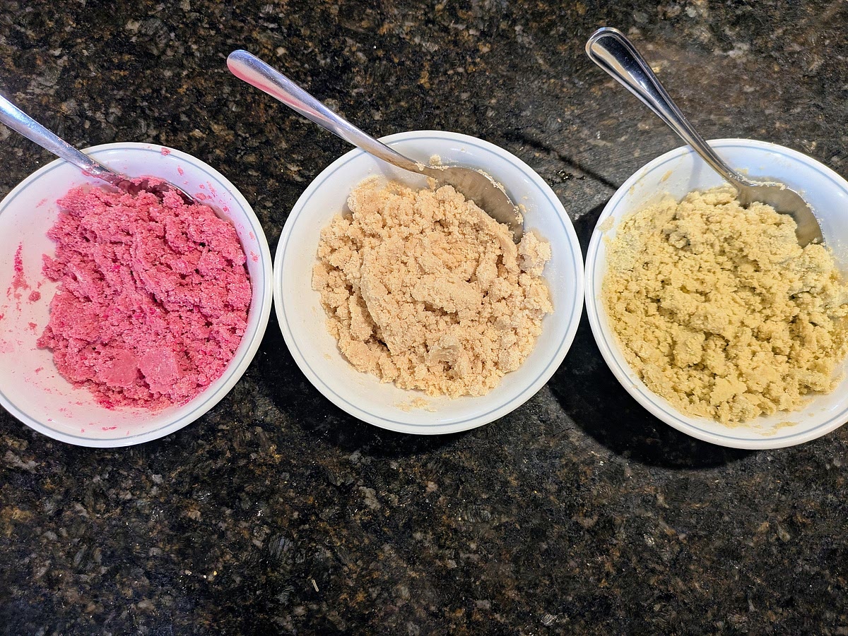 Add the cookie layer ingredients into their respective bowls, and mix with a silicone spatula to make a crumbly dough