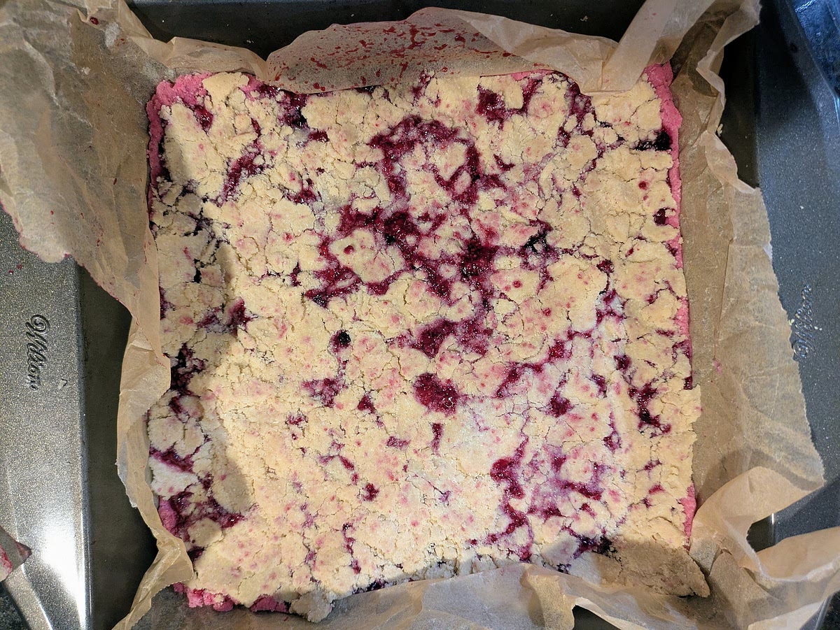 Dollop your white layer on top of the first jam layer. Evenly spread to all sides and fill in the holes. It will look a little messy