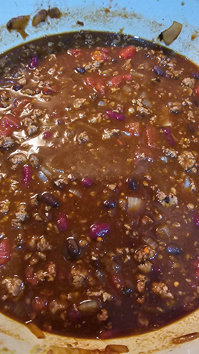 Add tomatoes, beans, stock
Simmer 45–60 mins you can go longer, the longer you simmer the deeper the flavor
If adding cocoa powder add it now.
If adding acidity add it in the last 20 minutes.