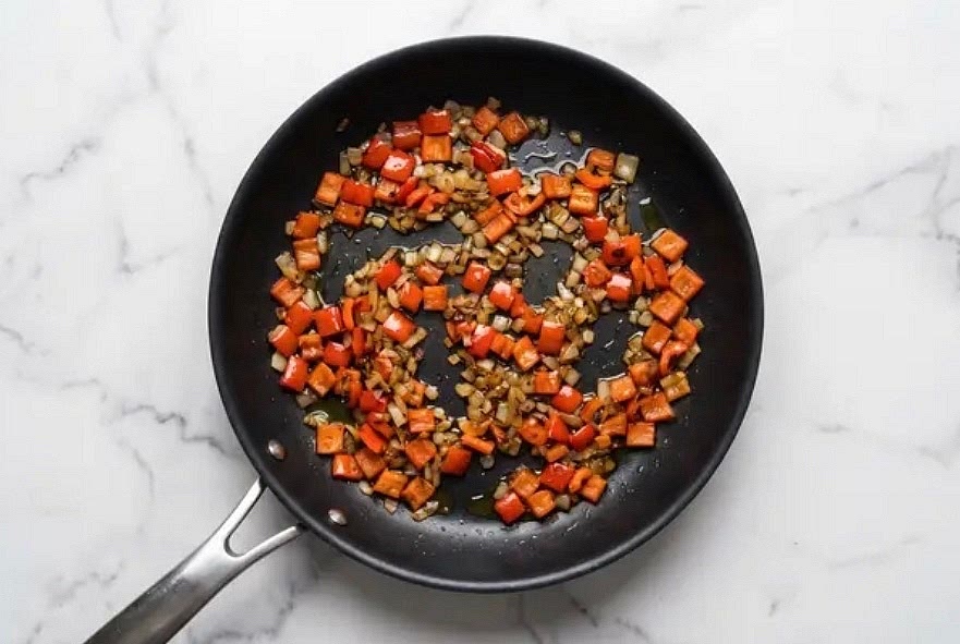 Heat a large drizzle of olive oil in a large pan over medium-high heat. Add bell pepper and onion; cook, stirring occasionally, until veggies are browned and softened, 4-6 minutes. Season with salt and pepper.