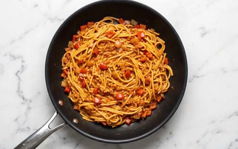 Add spaghetti and another drizzle of olive oil to pan with veggies. Cook, stirring occasionally, until noodles are golden, 1-2 minutes. Reduce heat to medium; add tomato paste, paprika, and half the garlic powder (you’ll use the rest later). Cook, stirring constantly, until fragrant, 30-60 seconds. Stir in stock concentrates and 1 cup hot water(2 cups for 4 servings) from pot. Bring to a simmer; cook, stirring occasionally, until water has absorbed. Repeat process with remaining hot water, adding ½ cup at a time, until water has absorbed and pasta is al dente, 10-15 minutes. TIP: It’s OK if you don’t use all the hot water.