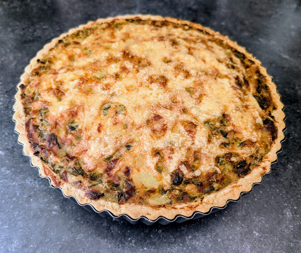 Take it out of the oven and leave it to cool for 15-20 minutes before popping it out of the tart tin.