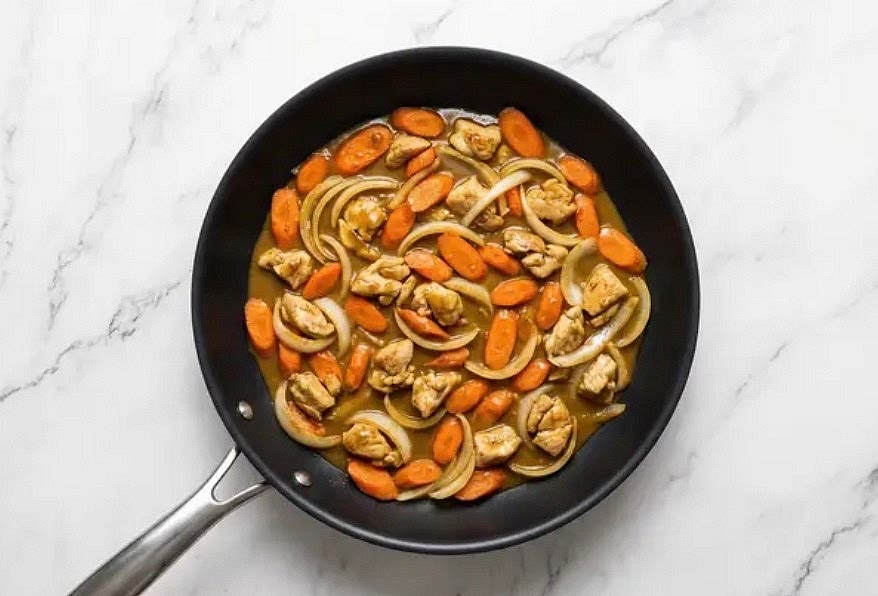 To pan with chicken mixture, add stock concentrate, Japanese-style golden curry paste, half the soy sauce, ½ cup water, and 1 tsp sugar(all the soy sauce, ¾ cup water, and 2 tsp sugar for 4 servings). Cook, stirring, until sauce has thickened and chicken is fully cooked through, 2-4 minutes. Turn off heat; taste and season with salt and pepper.