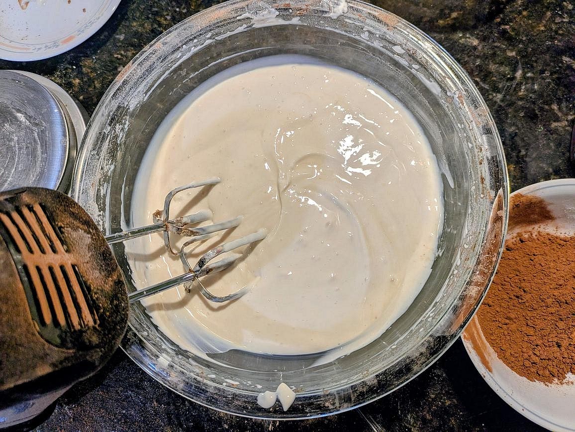 Slowly beat in the allulose until fully mixed