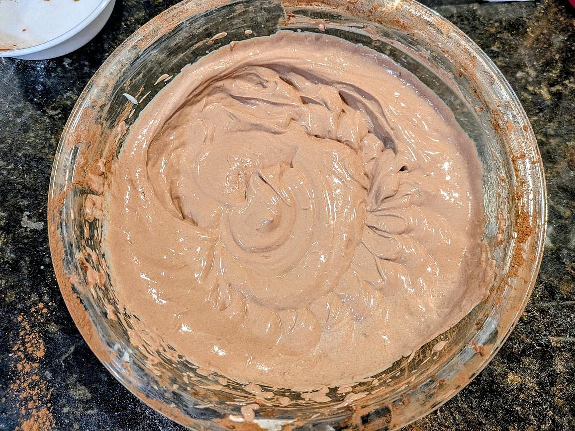 Slowly beat in the cocoa powder until fully mixed