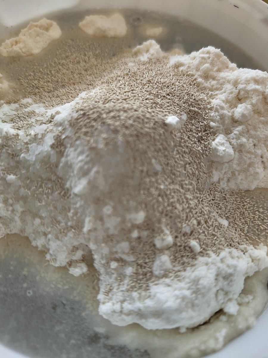 Mix all the ingredients together. It's easiest if you combine the dry ingredients and then make a well in the middle. Add a bit of water at the time, you can go faster as it becomes more liquid.