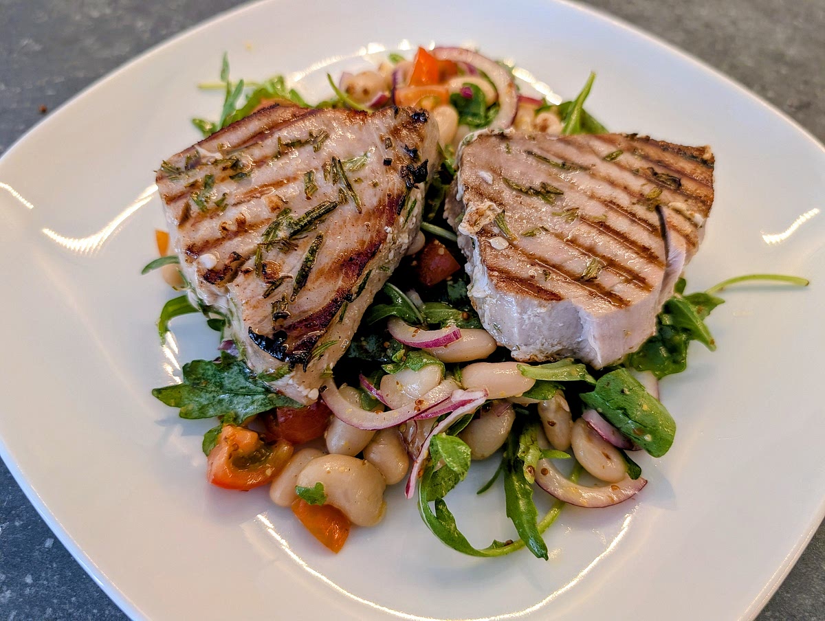Remove the tuna immediately from the griddle and plate it on top of the salad. Serve right away. Enjoy!