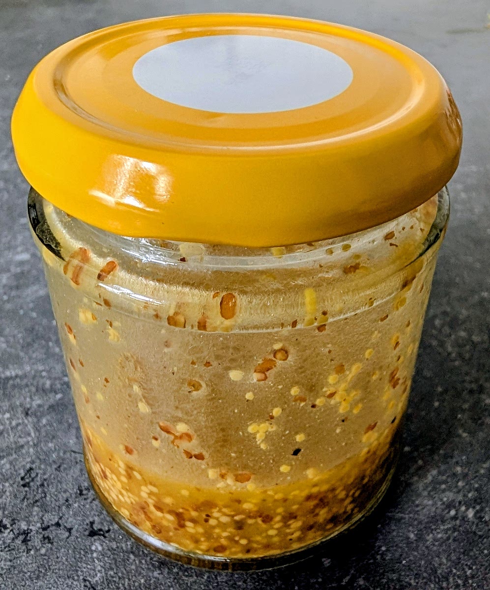 While the fish marinated, add the olive oil, mustard, honey, salt and pepper to a jar and shake well to make a homogeneous emulsion.