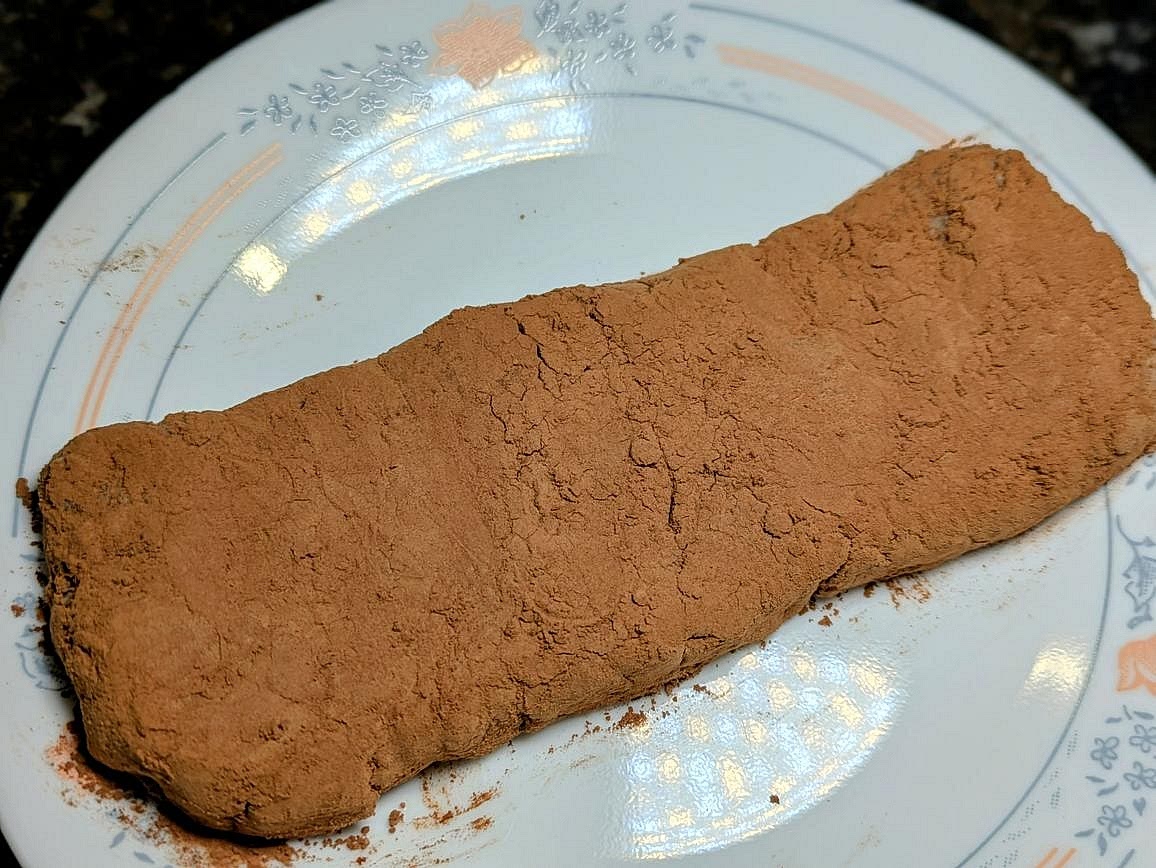 Lightly coat the outside with cocoa powder. Store in the fridge or freezer