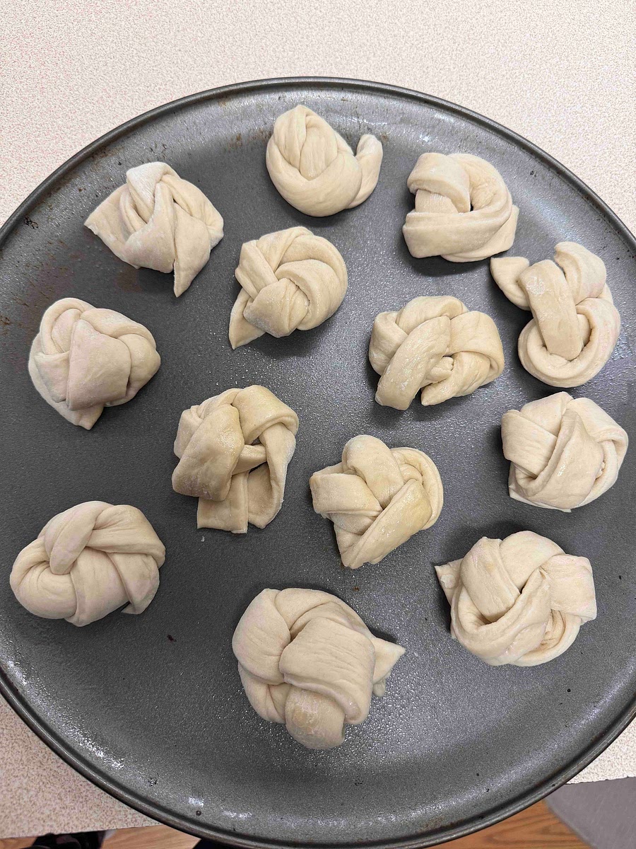 Cut into strips, and tie each into a knot. 4. Proof: Let the knots puff up for 1–2 hours.