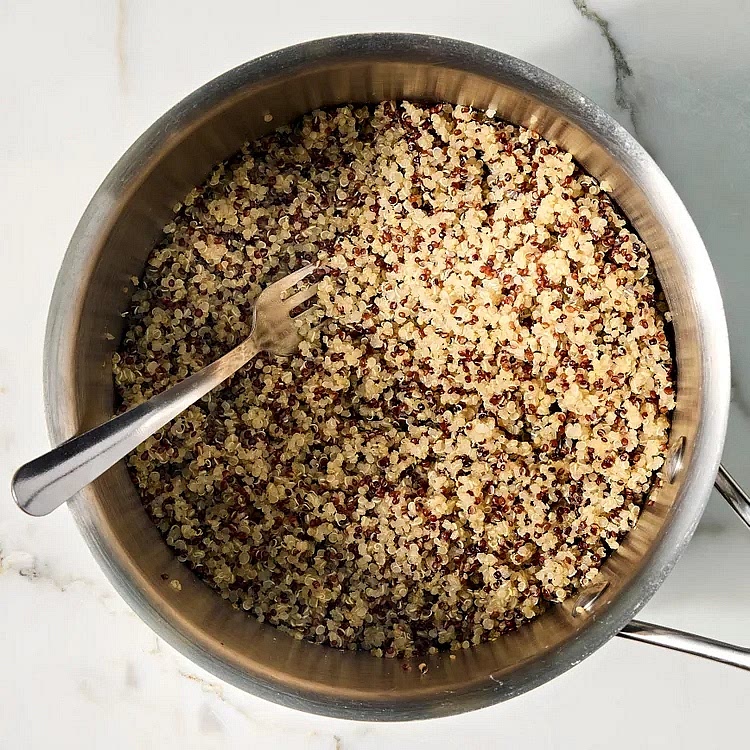 Preheat oven to 375°F. Combine rinsed quinoa and 1⅓ cups broth in a medium saucepan; bring to a boil over high heat. Reduce heat to medium-low, cover and cook until the liquid is absorbed and the quinoa is tender, about 15 minutes. Remove from heat and let stand, covered, for 5 minutes. Fluff with a fork.