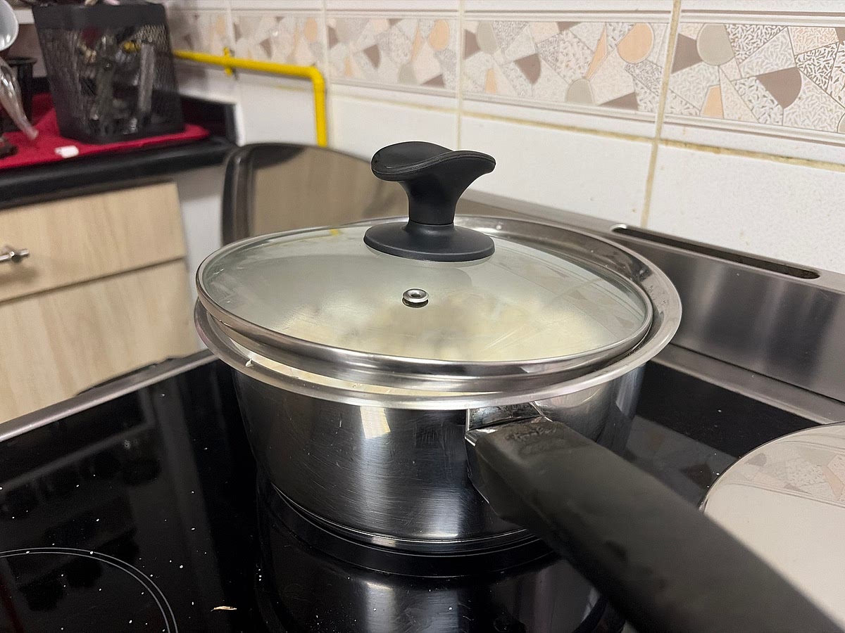 Simmer on very low heat (add a little gap to the lid) for 20 min. Put on high heat until it starts to boil then onto medium low heat