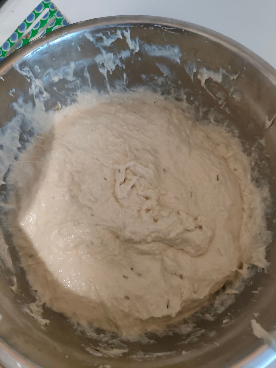 After five minutes, the dough should be smooth. Even after it's smooth keep mixing for a while. This ensures air has been properly infused into the dough.
