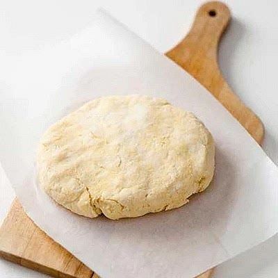Flatten to a disk - wrap in greaseproof paper. Leave the dough to rest in a cool spot or the fridge for half an hour or longer.