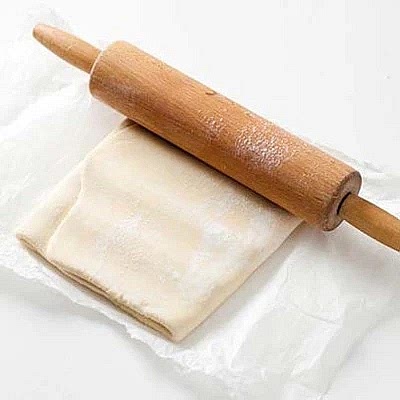 Firmly indent the pastry with a rolling pin before covering with greaseprrof paper to rest for half an hour in the fridge.