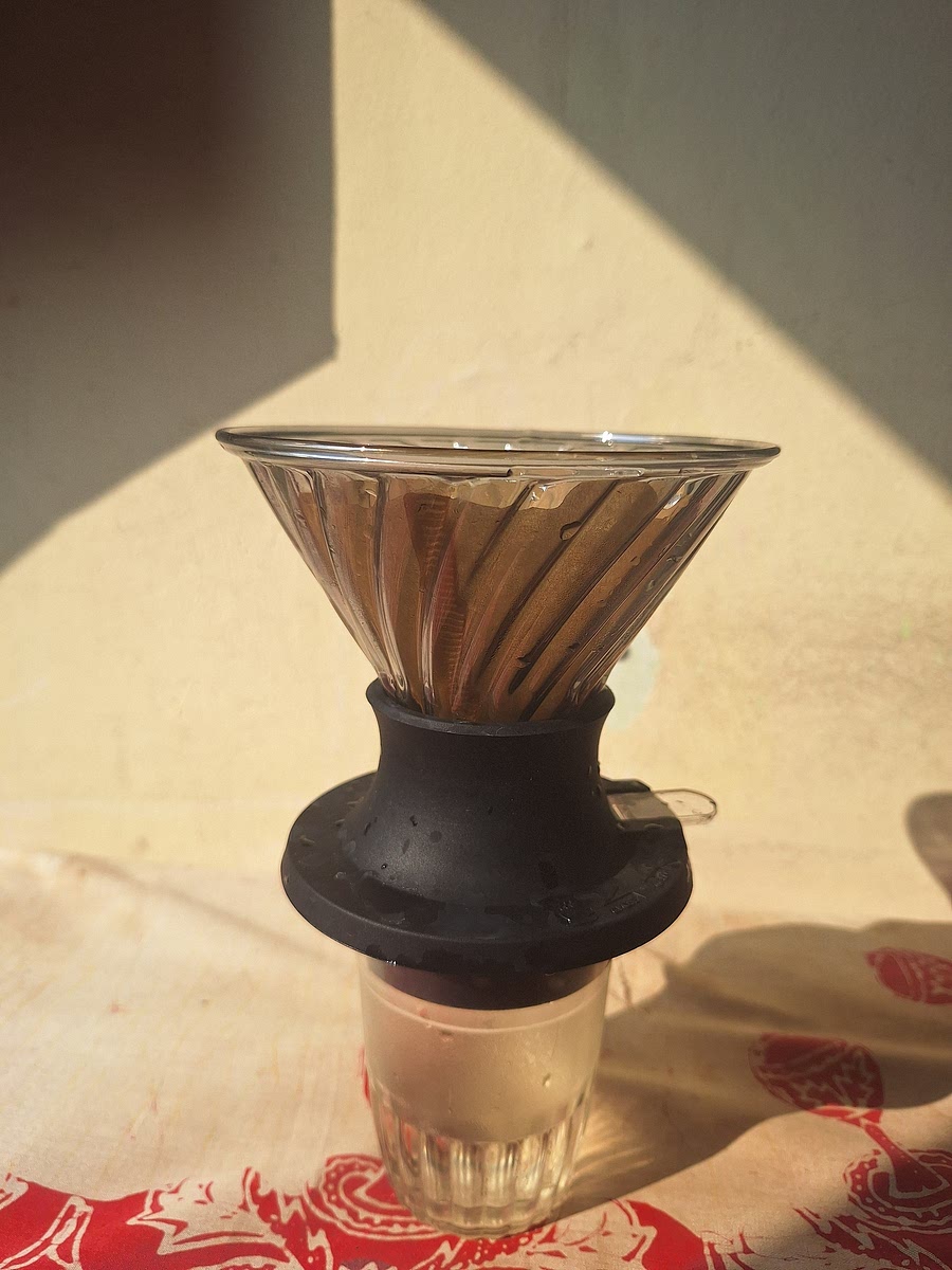Rinse the paper filter with hot water.