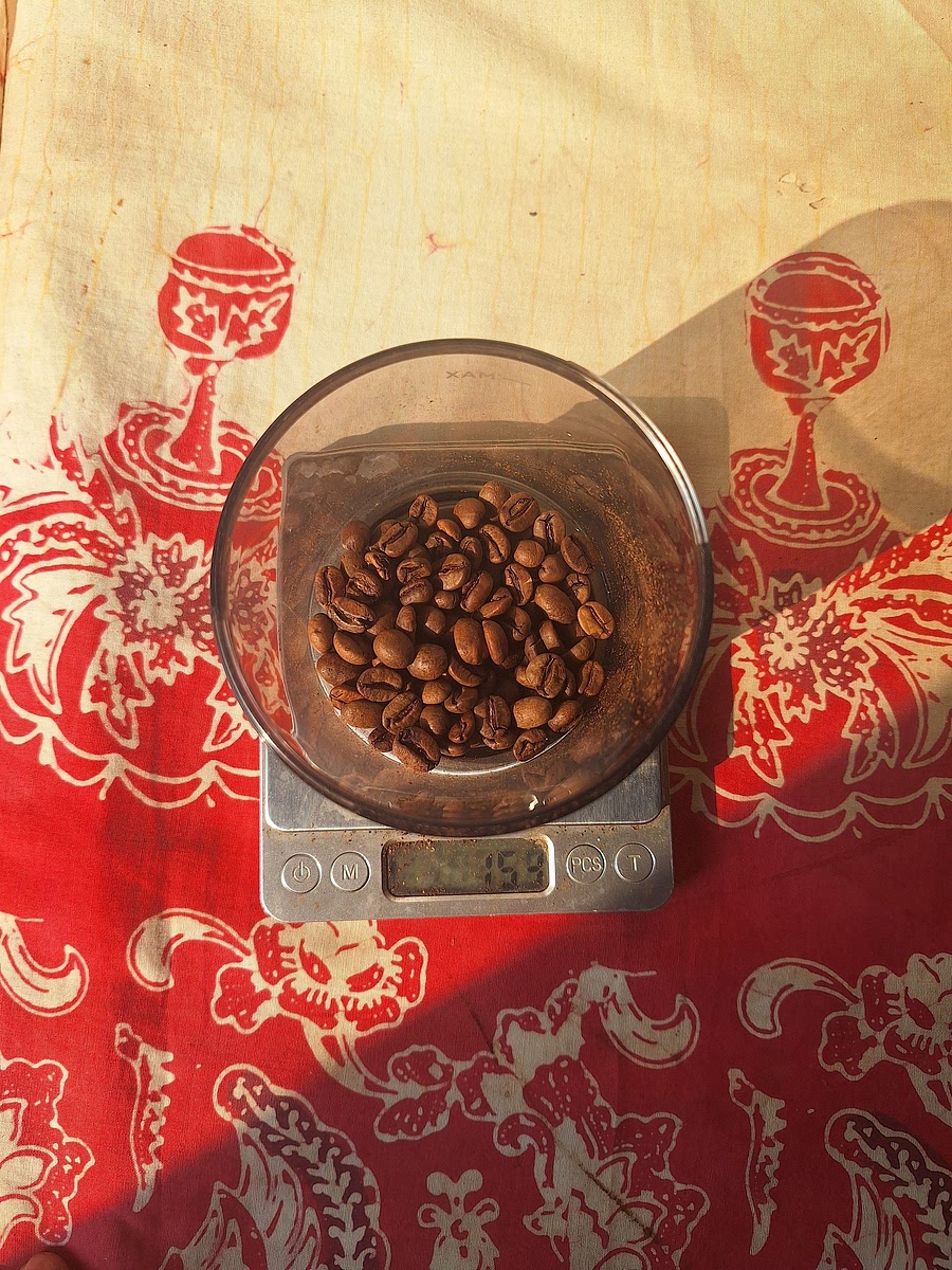 Grind 15 grams of coffee beans.
