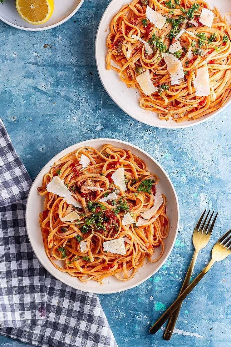 Remove the pan from the heat. Reserve 3-4 tablespoon pasta water and drain the pasta. Add the cooked pasta, capers and salmon to the sauce and toss well. Add enough pasta water until you reach your desired consistency and toss again. Add the lemon juice just before serving. Serve topped with fresh parsley and parmesan if desired.