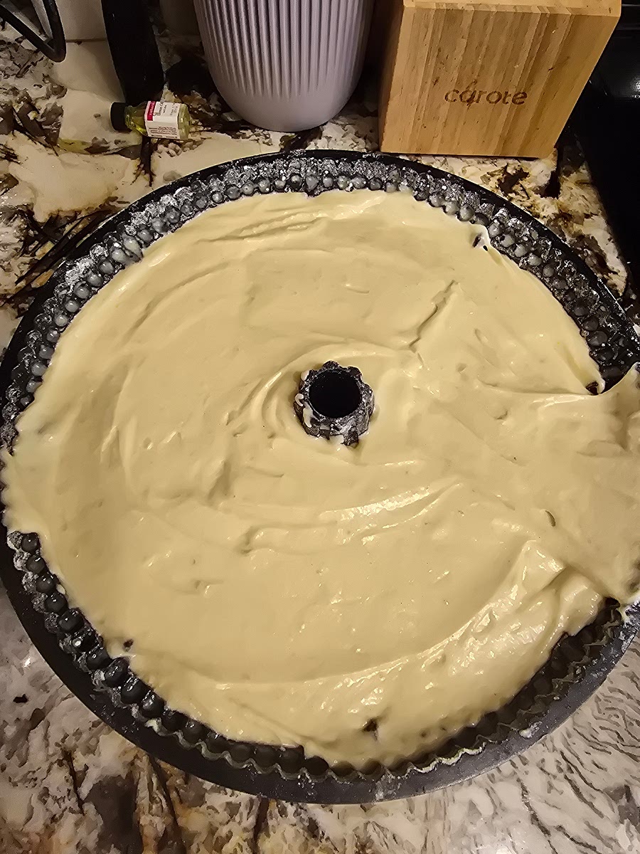 Transfer Batter: Transfer the batter to the prepared pan, smooth the top with a spatula, and firmly tap the pan on the counter to release any air bubbles.