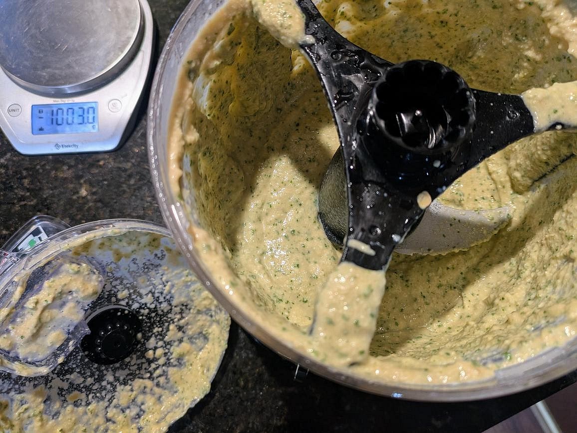 Add all ingredients (cashews, aquafaba, beans, lemon juice, apple cider vinegar, liquid monk fruit, and fresh mint) to a food processor. Blend until smooth and creamy