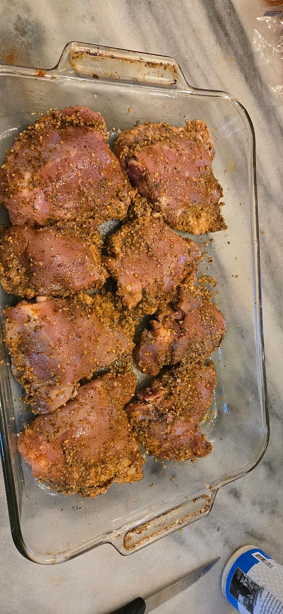 Remove skin from chicken thighs. Drizzle thighs with olive oil. Season with salt, pepper, garlic, greek seasoning, and paprika. (You can use other spices that you have on hand) Mix together to coat chicken in seasonings.