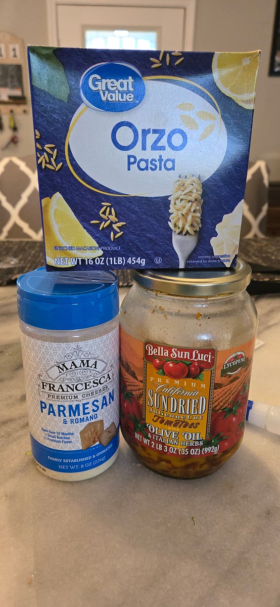 Remove chicken from the oven. Pour orzo, sundried tomatoes, and broth over chicken and mix. Nestle the chicken into the orzo so there is not any orzo on top of the thighs. Sprinkle the tops of the chicken with parmesan. Bake for about 20-30 minutes until the liquid is absorbed and the orzo is cooked.