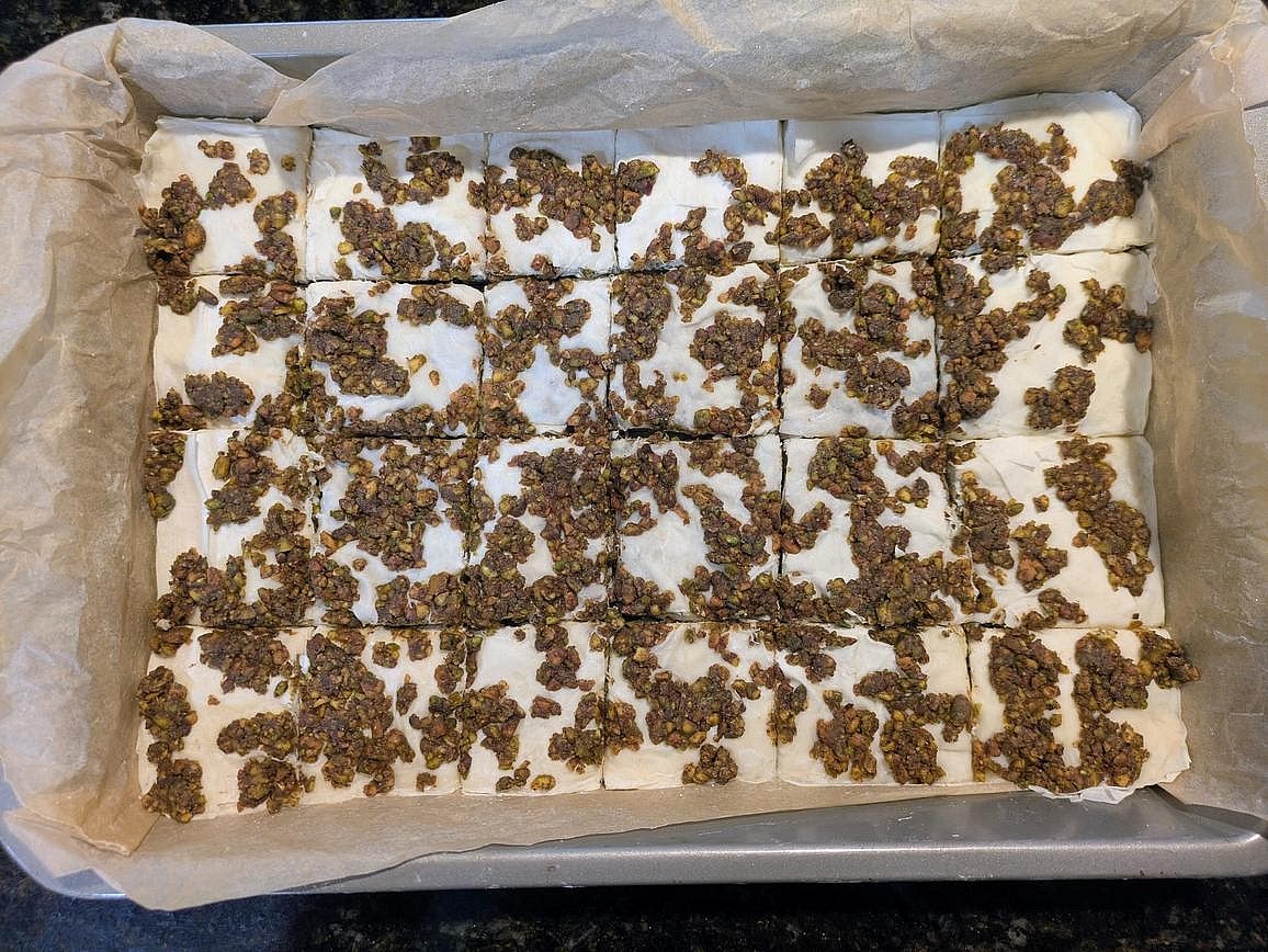 Using a sharp knife, cut your baklava into 24 squares