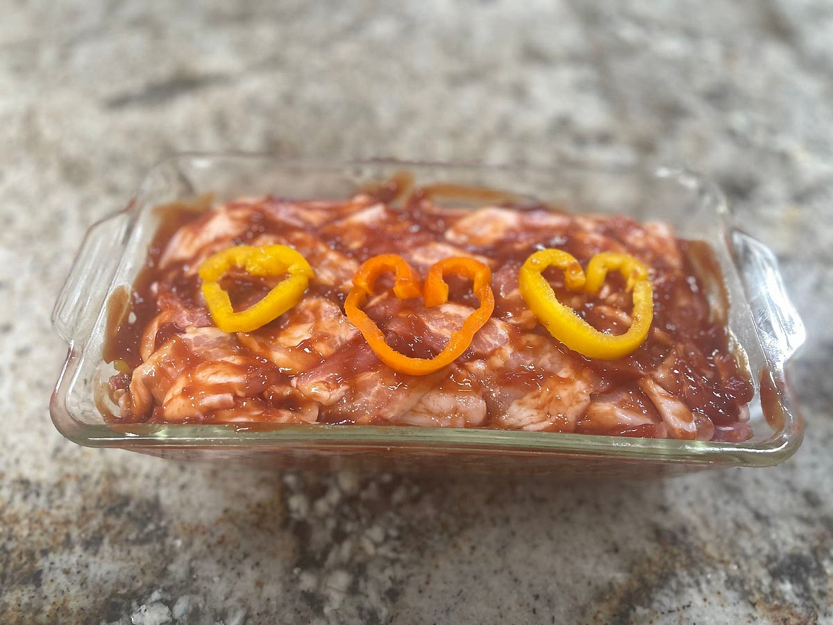 Depending on the container best suited for your entertaining needs foil or Glass is just fine. Lay your 🥓 Bacon in the pattern you would like across the bottom of the pan leaving the excess out of the pan. I like to do a herringbone pattern just for looks.