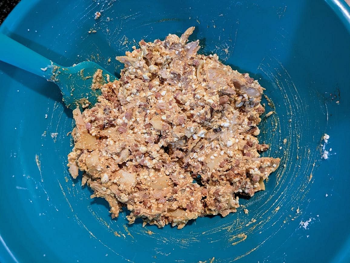 In a large bowl, combine ham, cooked chicken, (blended) cottage cheese, mustard, swiss, paprika, garlic powder, onion powder, and black pepper