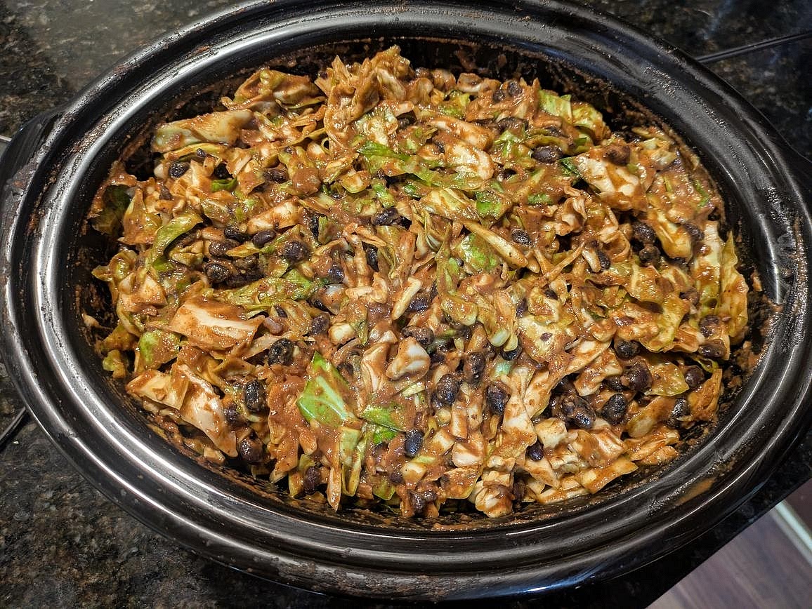 6 am - Add your cabbage, crushed tomatoes, peanut butter, and spices (chili powder, garlic powder, onion powder, and cumin) to the slow cooker. Mix to fully combine everything. Cover and cook on low for 8 hours
