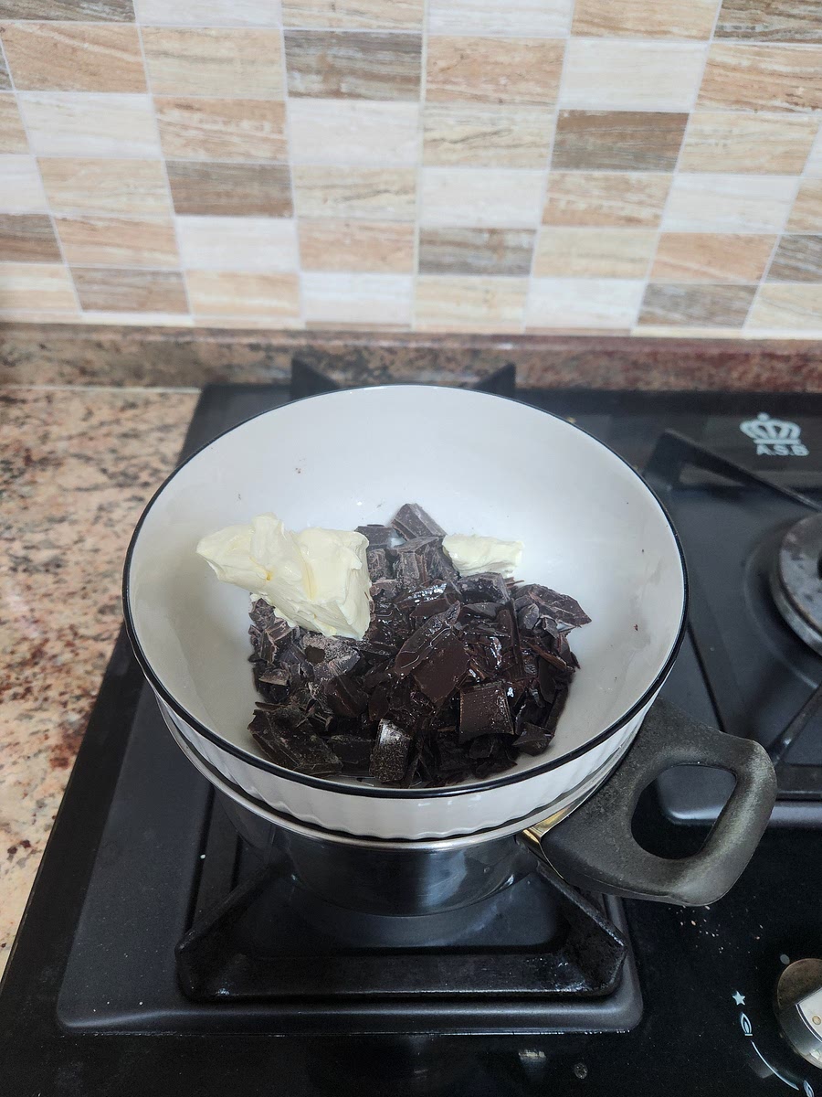 In a medium heat pot melt the chocolate, butter and oil together