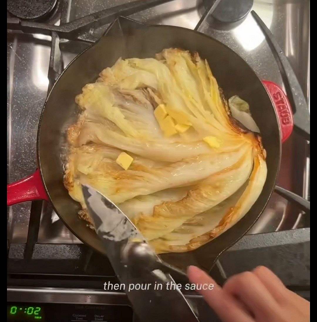 Flip the cabbage and add in a few small clumps of butter.