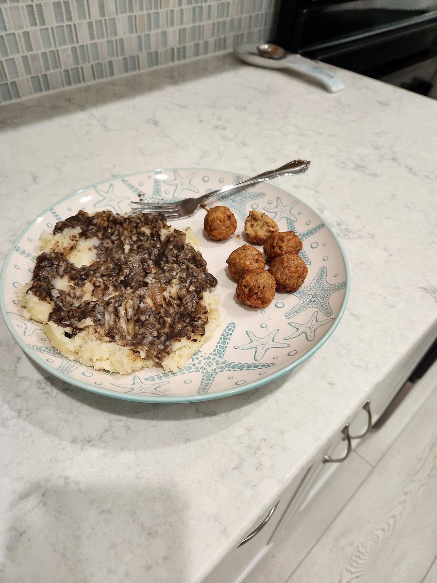 I serve my gravy over mashed potatoes seasoned with seasoned salt and oat milk. I like to also serve it alongside a bag of bite-size Aldi vegan meatballs (6 1/2 balls per serving). Makes 5 servings.